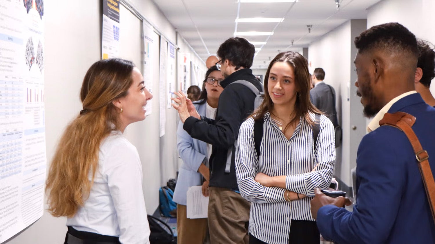 A student presents her research poster at Student Research Day 2025